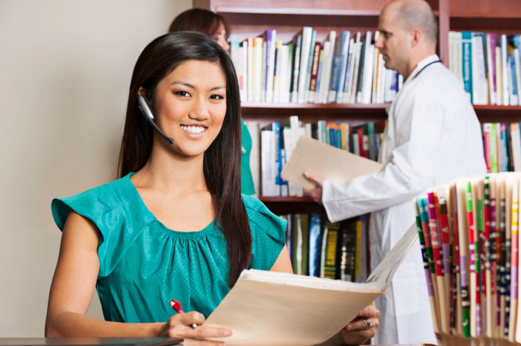 Medical Office Professional reading patient records